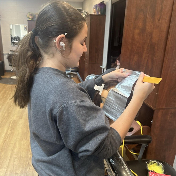 Cosmetology Seniors practicing partial highlighting