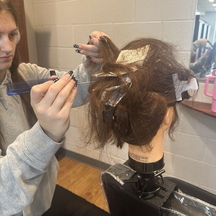 Cosmetology Seniors practicing partial highlighting