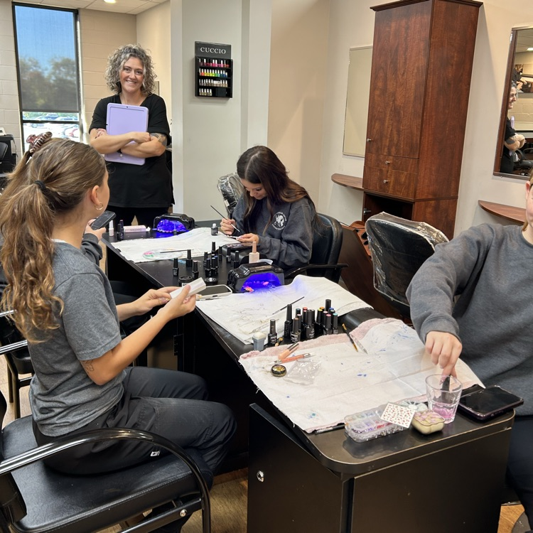 Students working on nail art