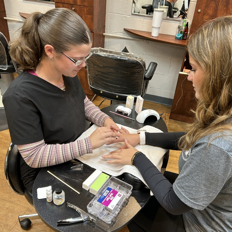 Students working on nail art