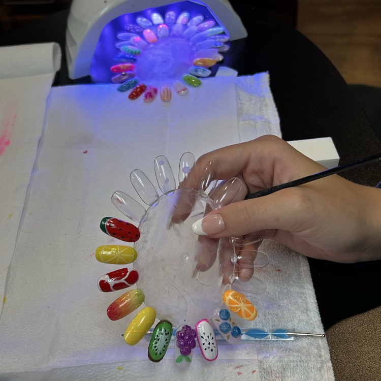 Students working on nail art
