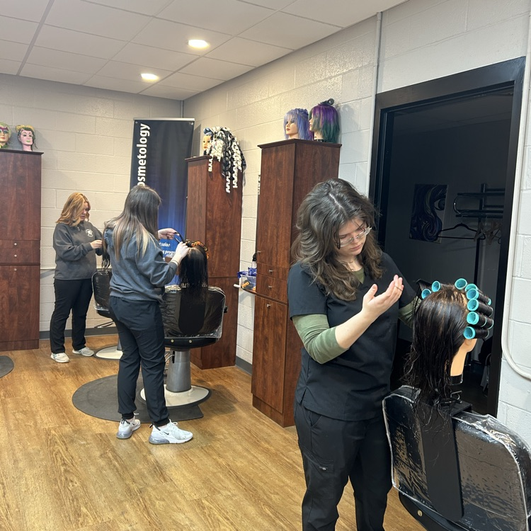 students putting in rollers for the first time