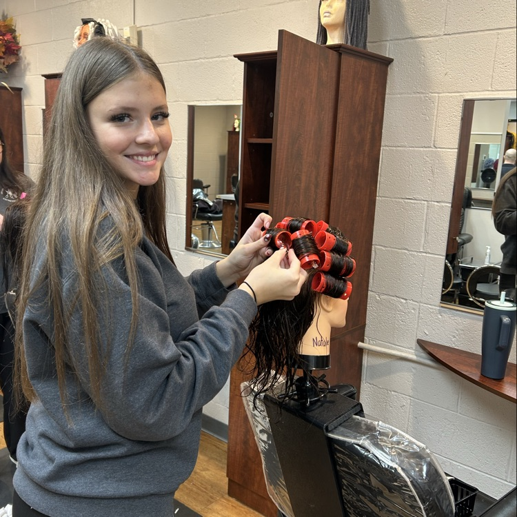 students putting in rollers for the first time