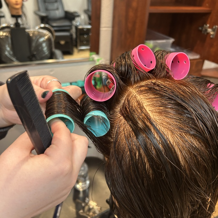 students putting in rollers for the first time