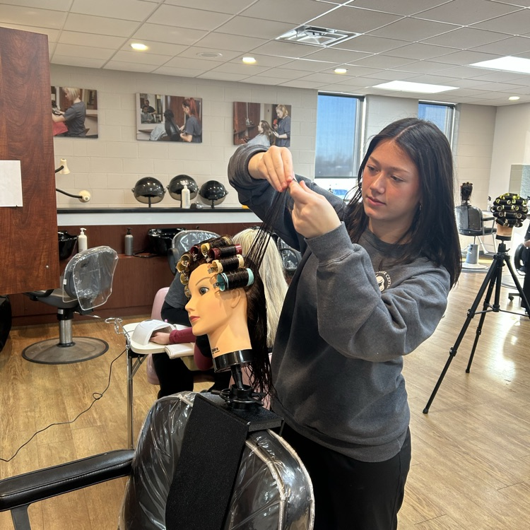 students putting in rollers for the first time
