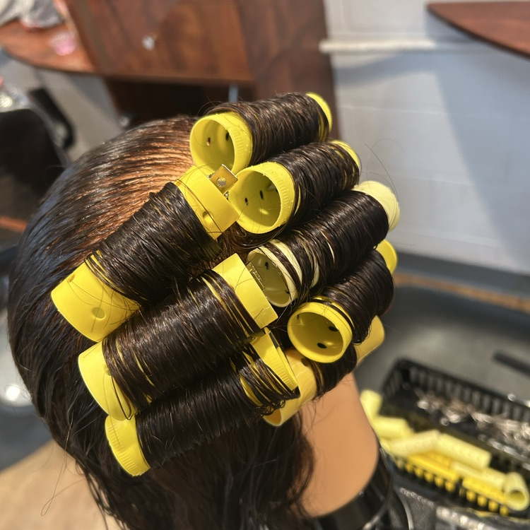 students putting in rollers for the first time