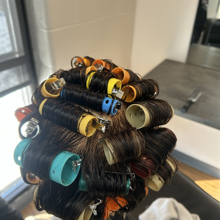 students putting in rollers for the first time