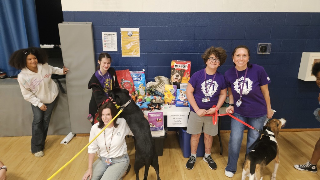 Resiliency Lodge students with donations and the adoptable shelter dogs!