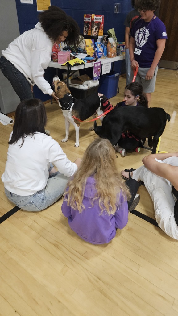 Rosie and Theo meeting students and staff.