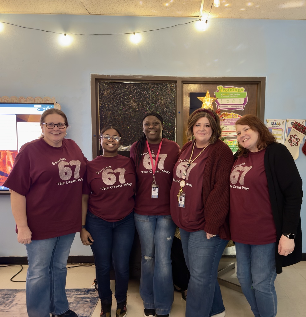 Grant teachers celebrate the 67th day of school with matching shirts that display the numbers “67”