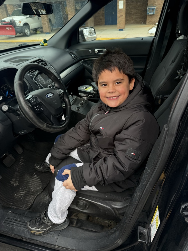 Second grade students excited to sit in Officer Stitt’s car. 