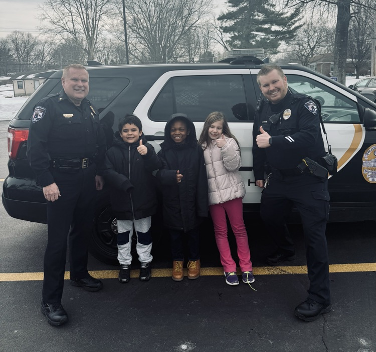 Second grade students excited to sit in Officer Stitt’s car. 