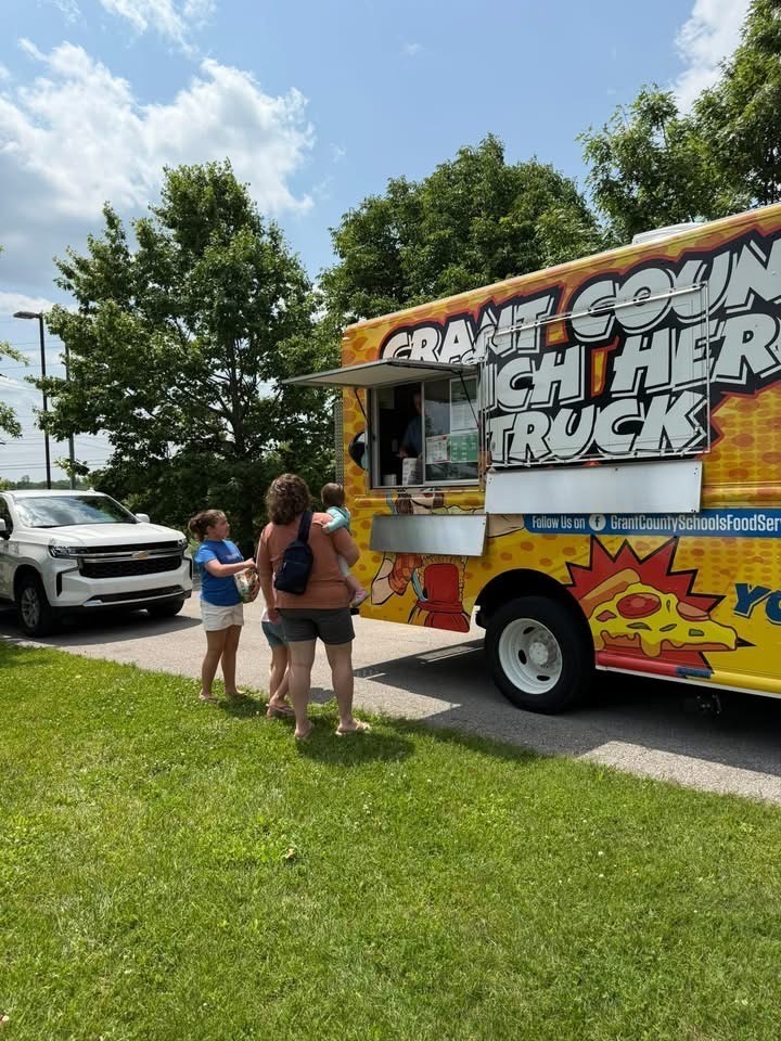 Yellow food truck and green grass