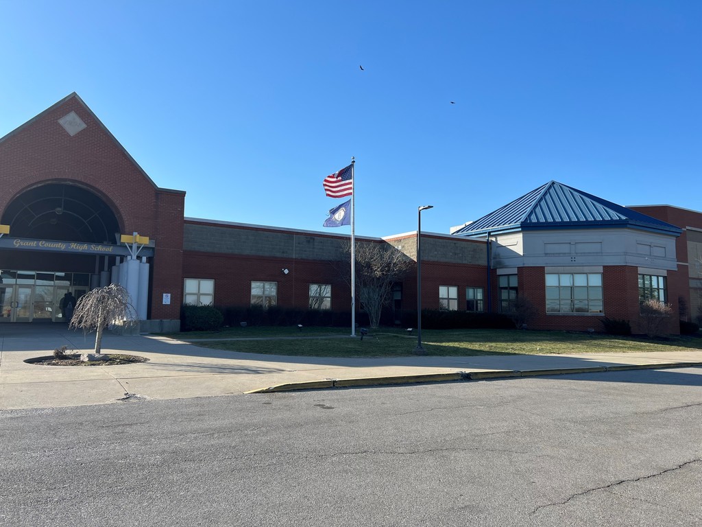 School, blue sky, red bricks, American flag