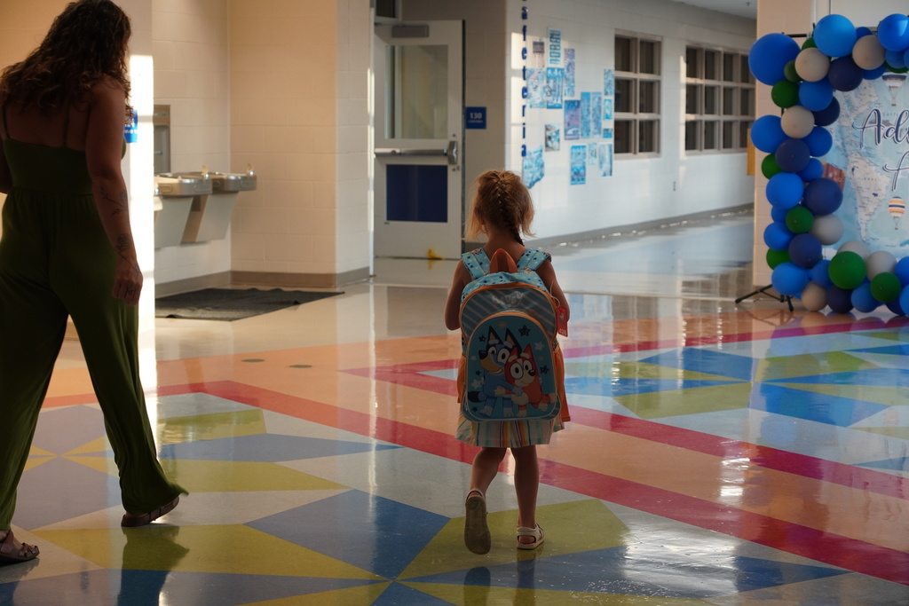 Little girl, Bluey backpack, parent, school hallway