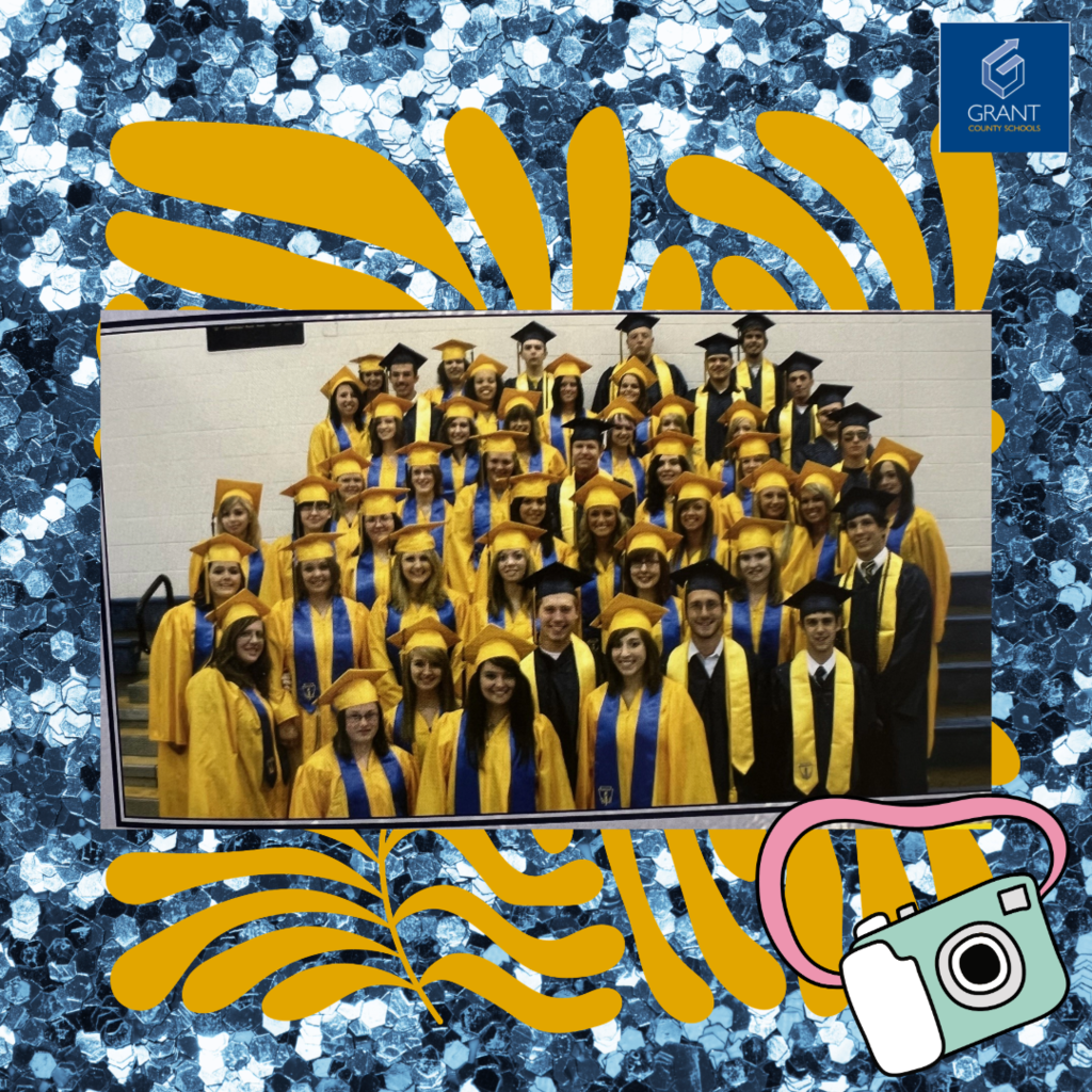 Graduates in yellow gowns and blue background