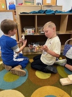 students playing in cubbies