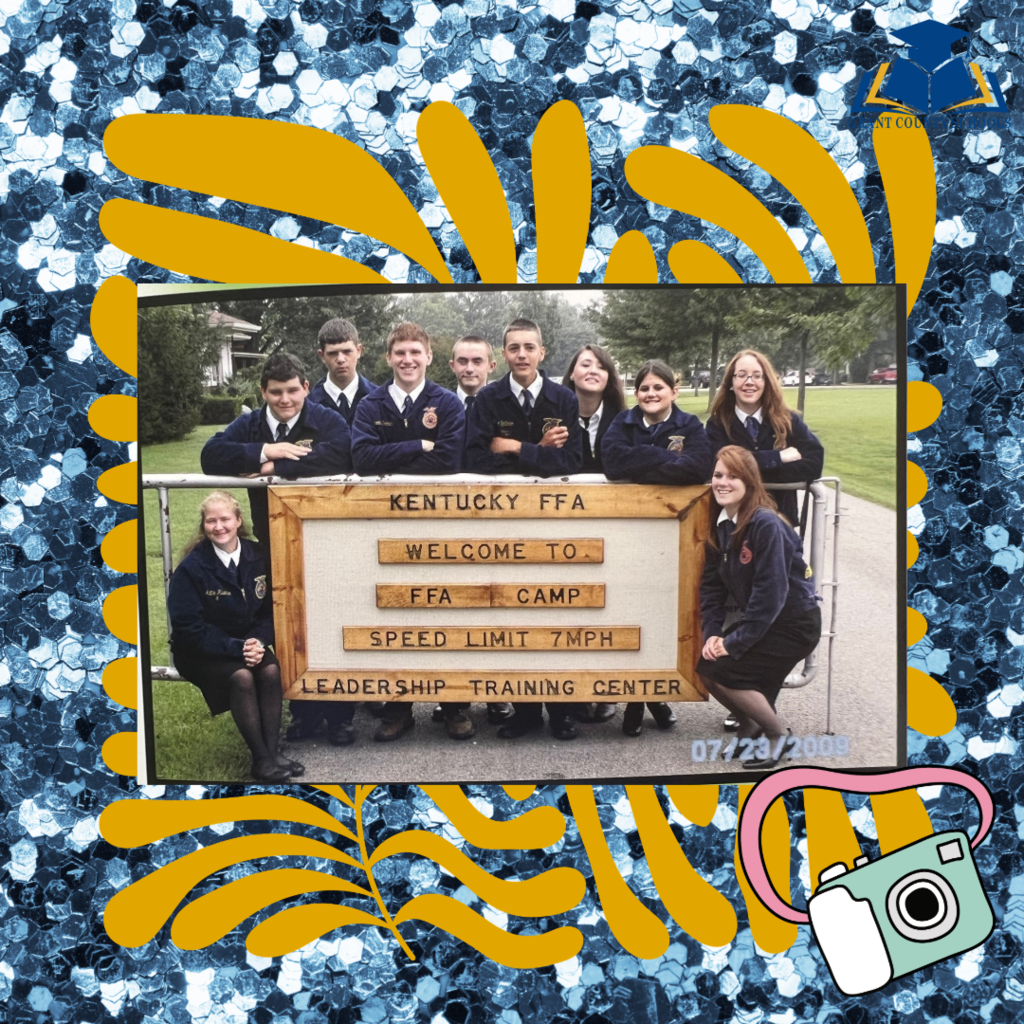 FFA Students in front of sign.