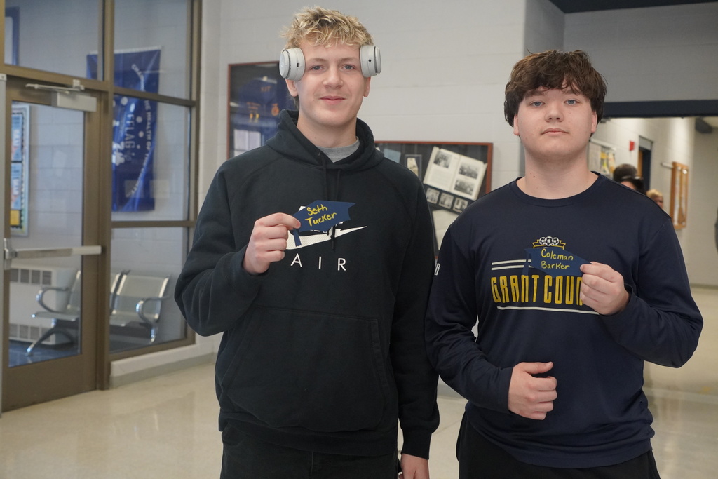 Students pose with their name