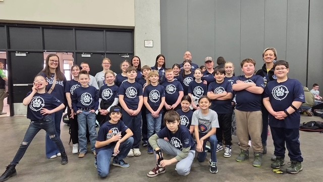 Children in blue t shirts
