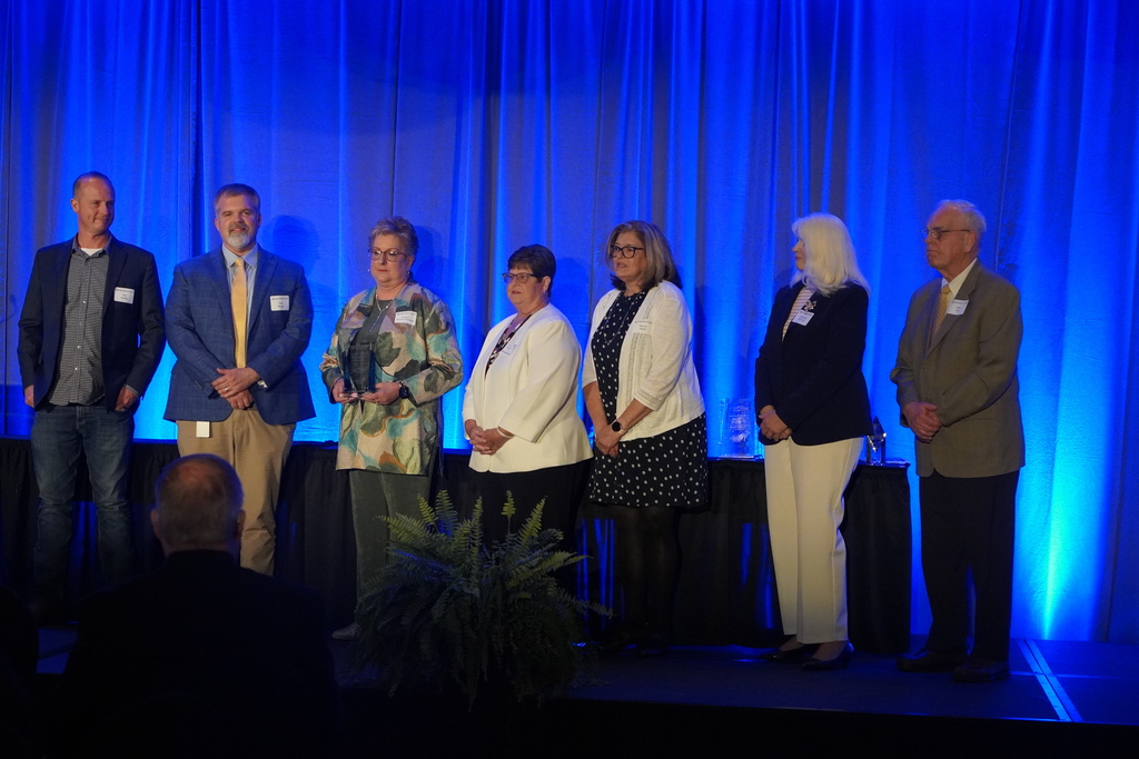 A group on the state with a blue background
