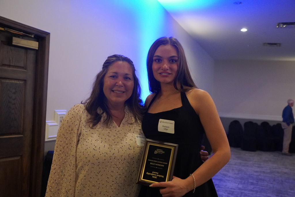 Woman with brown hair and young woman with brown hair