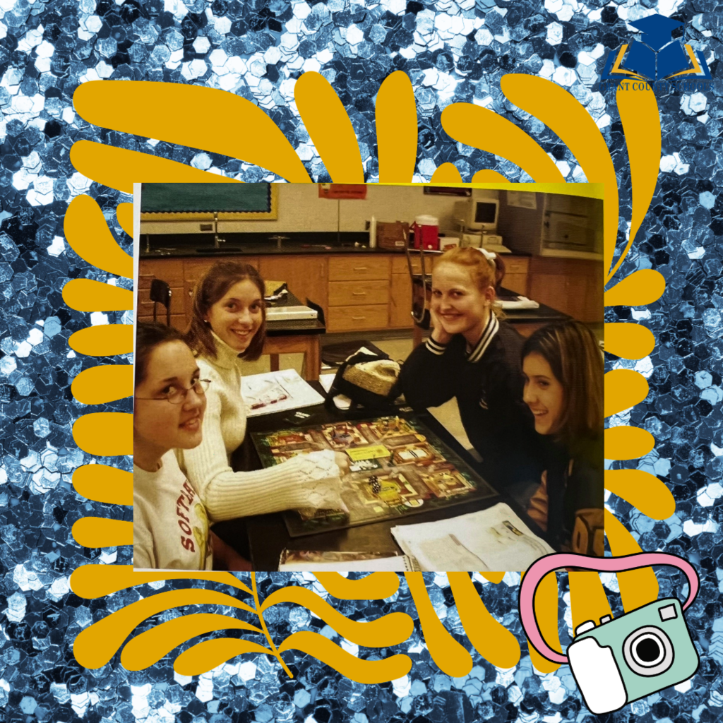 Four Girls smiling while sitting at a table
