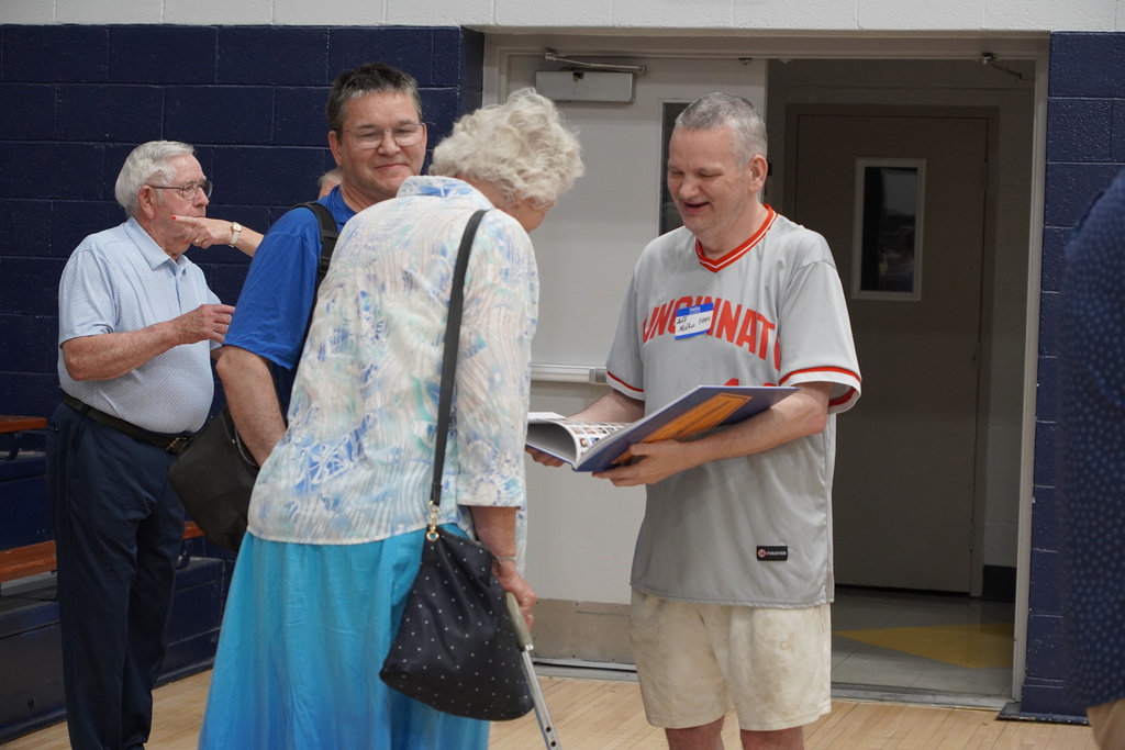 Men and Woman looking at book