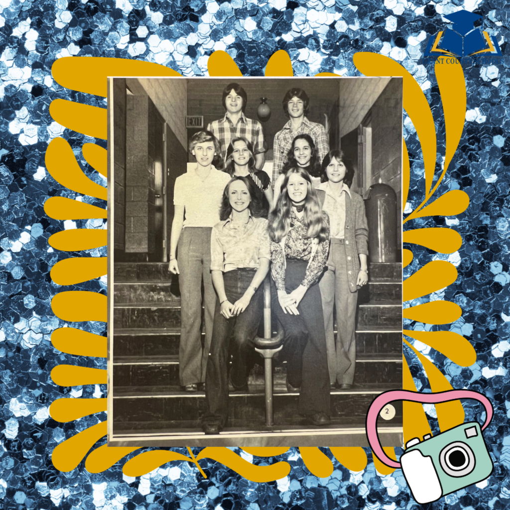 Vintage photo of school students in a hallway smiling