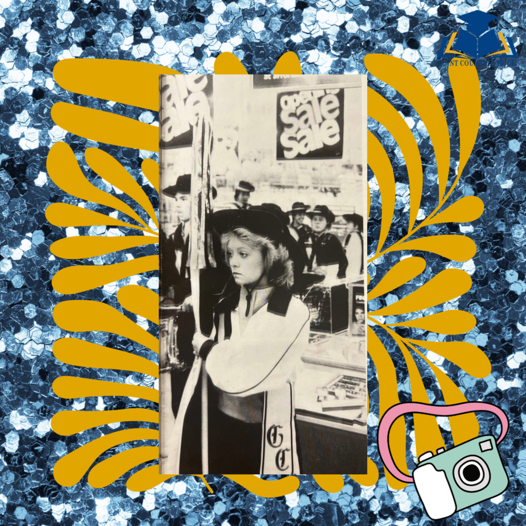 Blue background, yellow border, black and white photo of a girl.