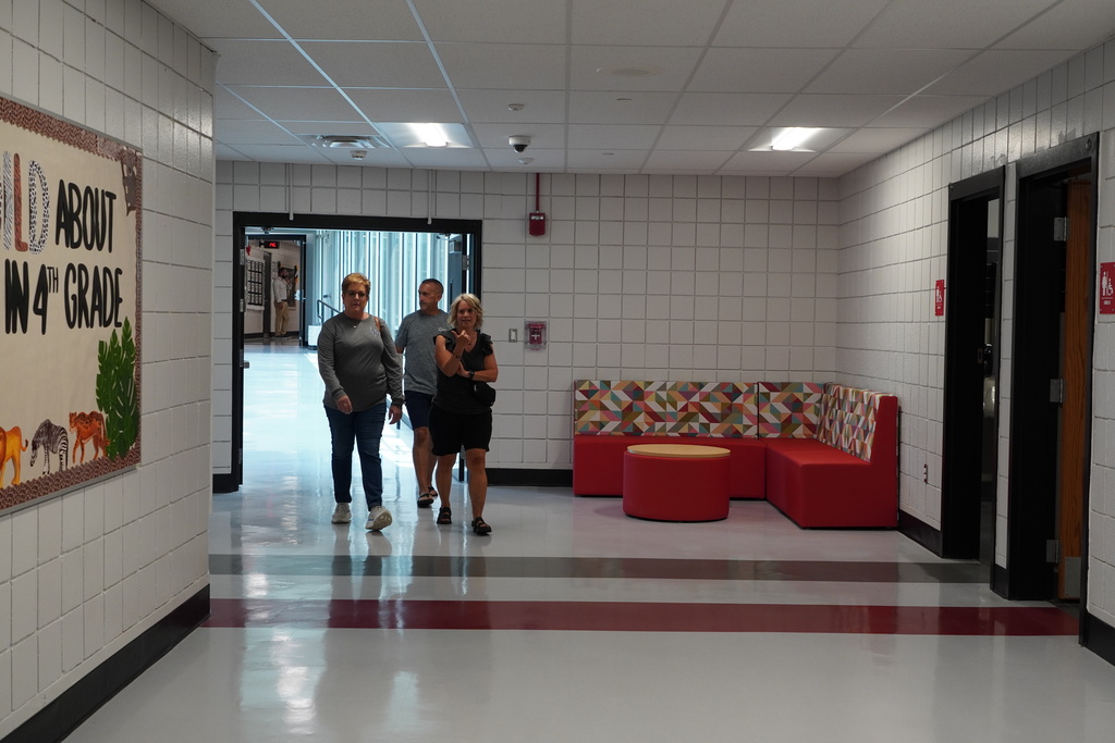 Hallway with people and furniture