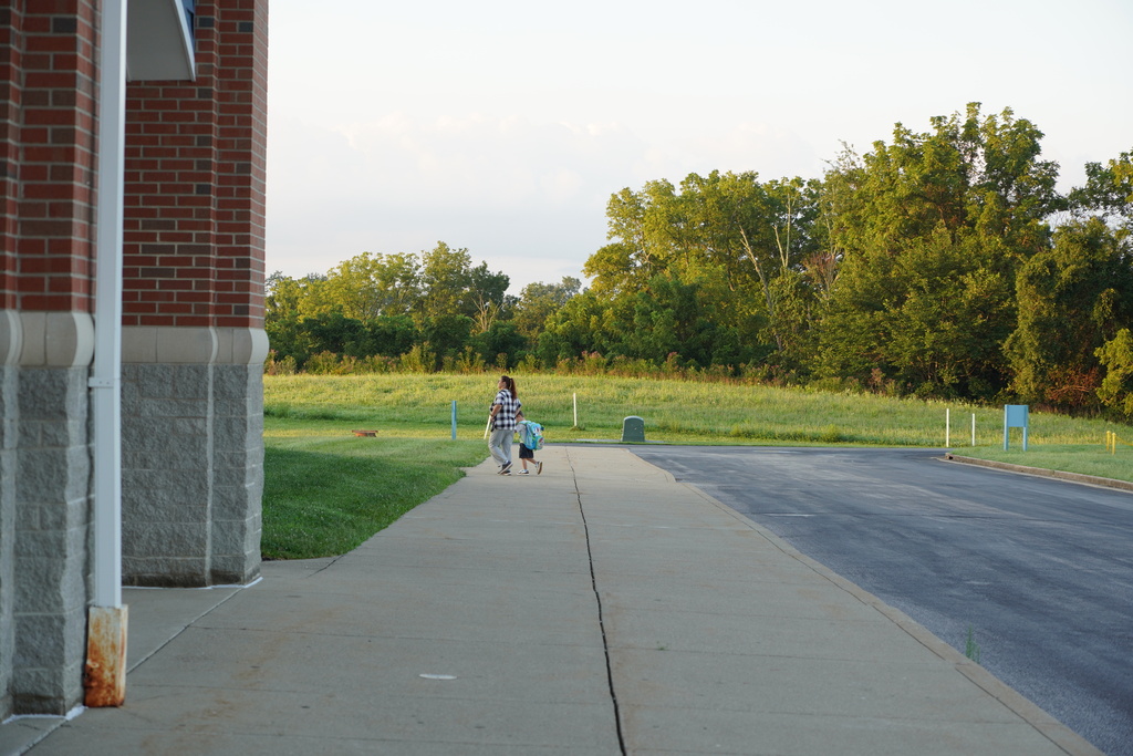 Parent walking a student into school