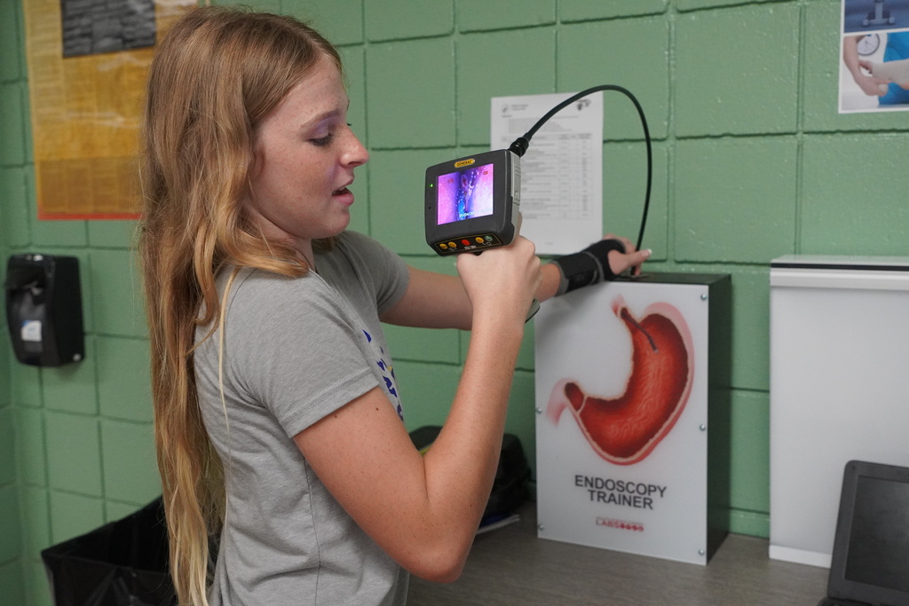 Girld holding an endoscopy camera