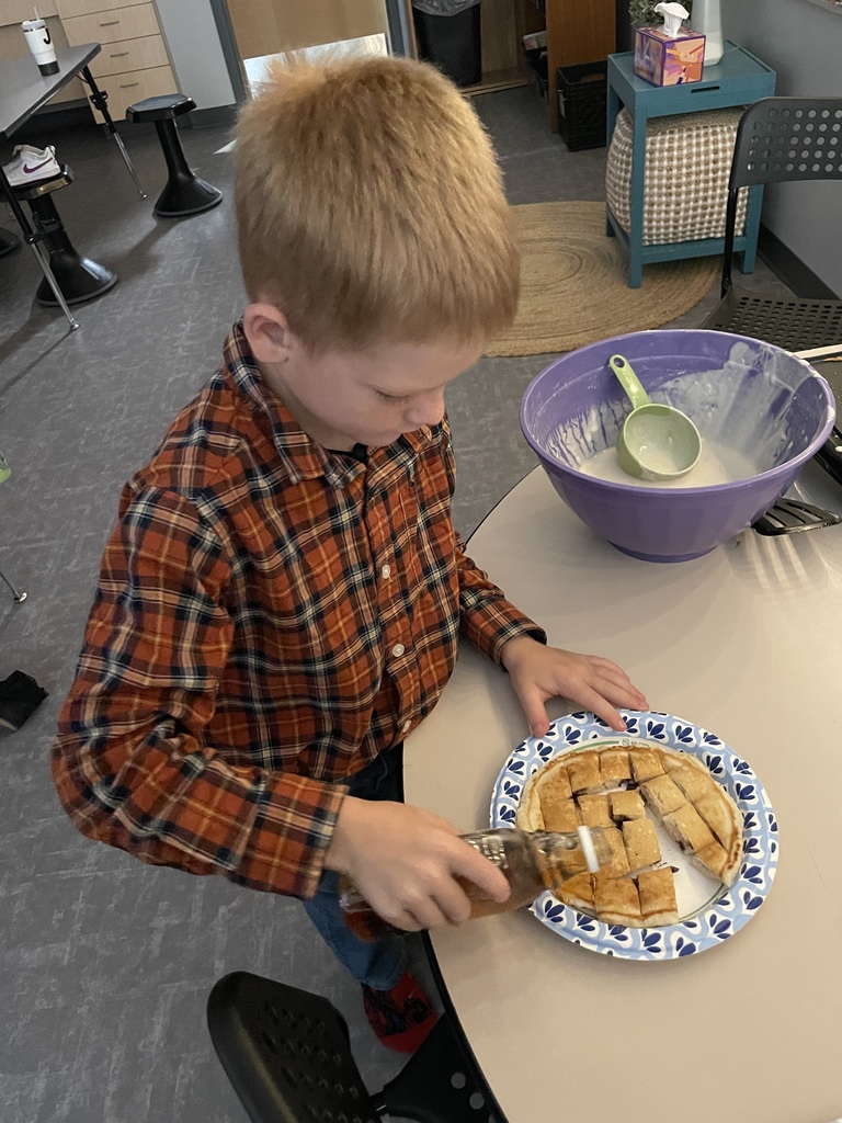 Second graders completed their Fairy Tales and Tall Tales unit and celebrated by having a “Flapjacks and Flannel” day. Students enjoyed COLOSSAL size pancakes like they read about in the story of Paul Bunyan. Although the pancakes weren't quite as big as in the story, they sure were delicious!