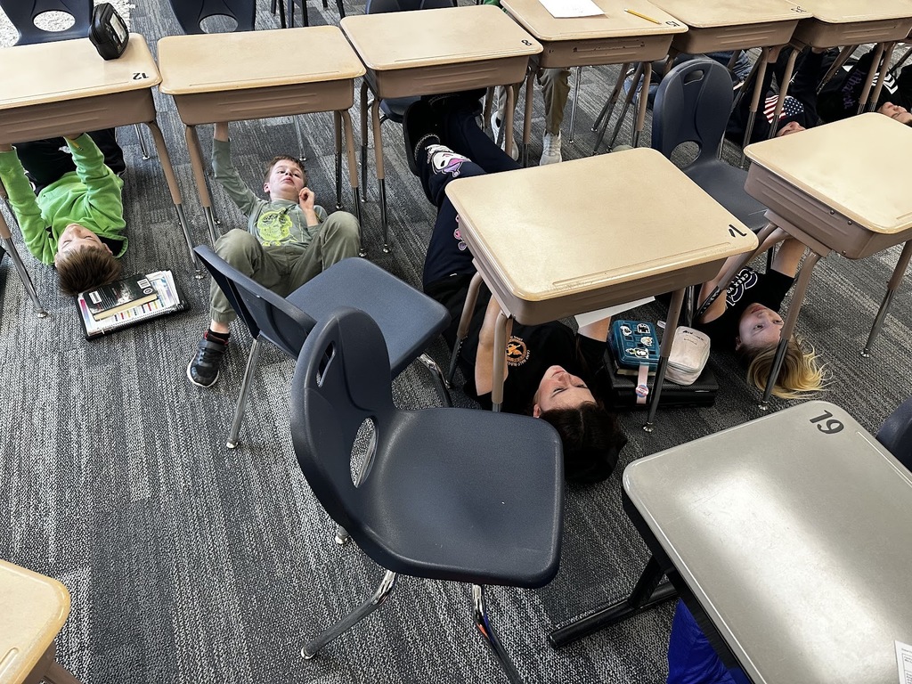 GMS Students painting self portraits like Michaelangelo!