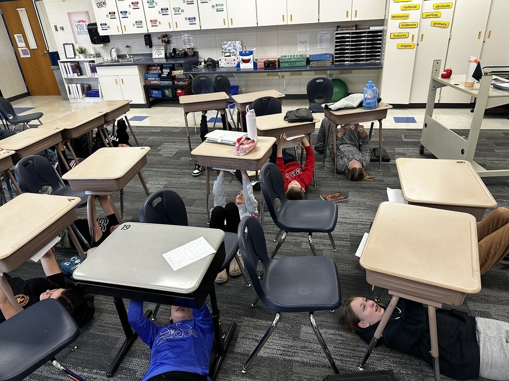 GMS Students painting self portraits like Michaelangelo!