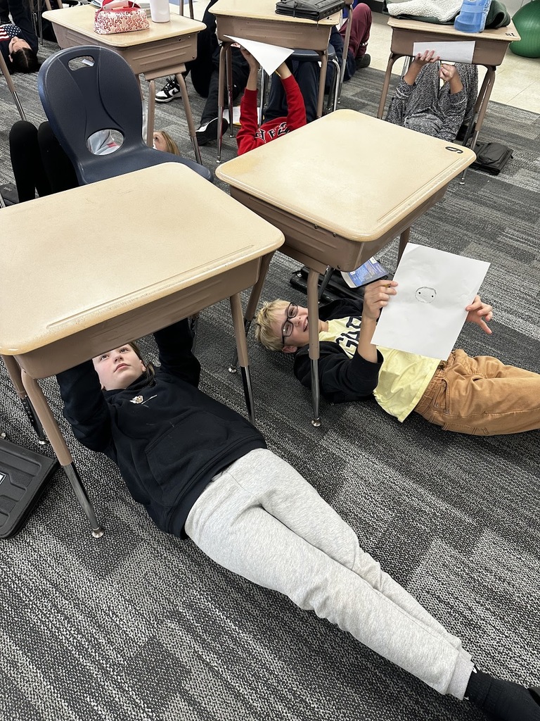 GMS Students painting self portraits like Michaelangelo!