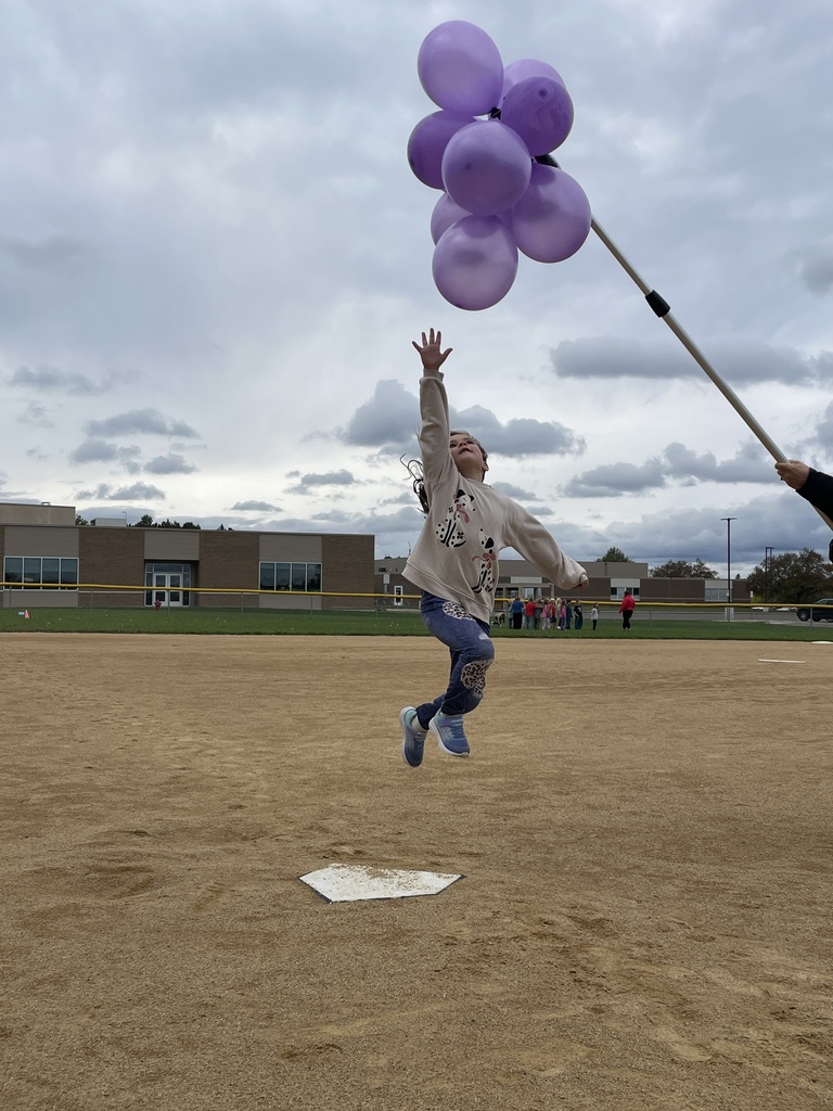One student tries to touch the grapes like in the story "The Fox and the Grapes."