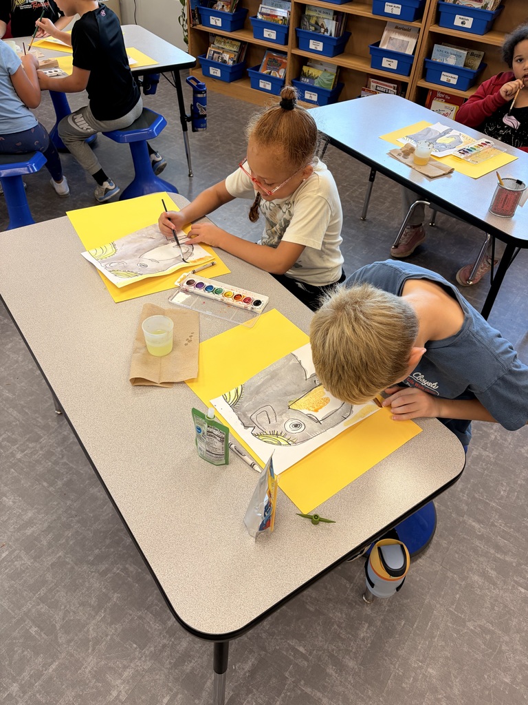 Two students design their own elephants.