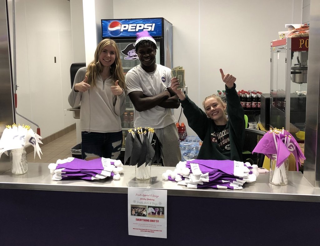 Students selling hats in high school commons