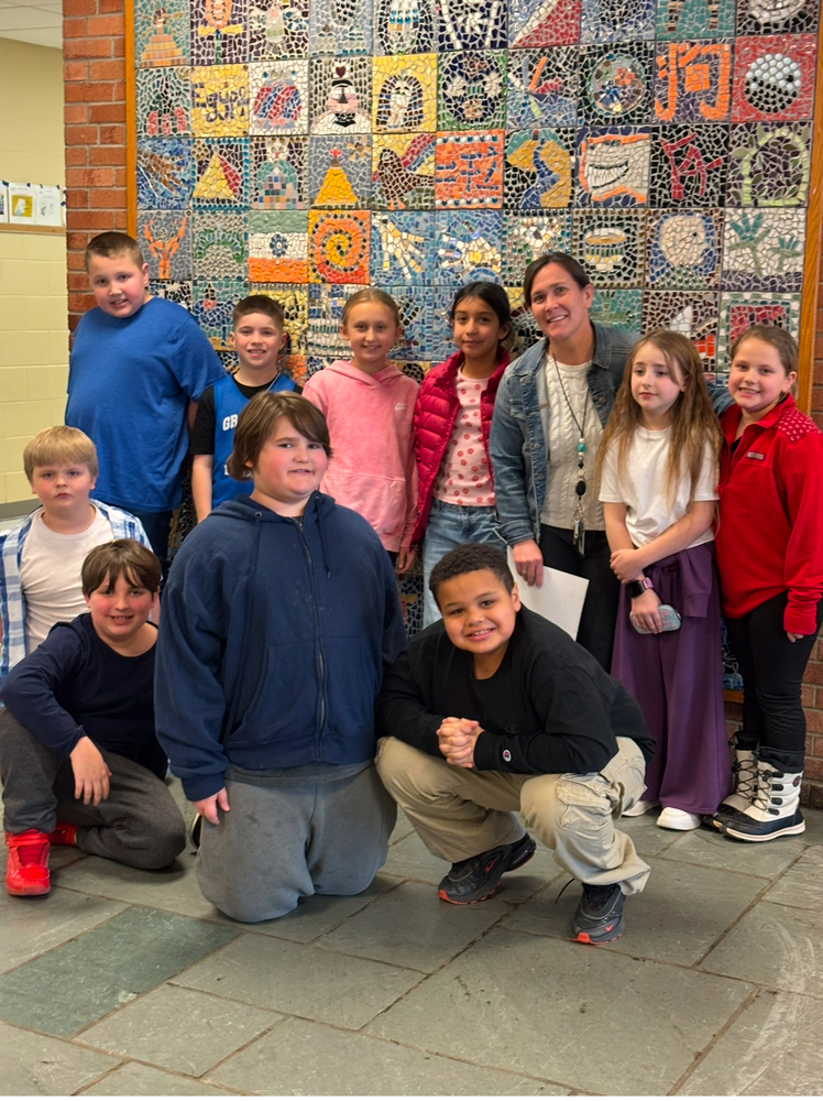 An image of Mrs. Nolan and a variety of her students