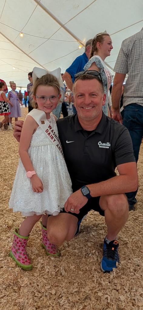 Superintendent Michael Hall with a youth Dairy Ambassador at the Washington County Fair