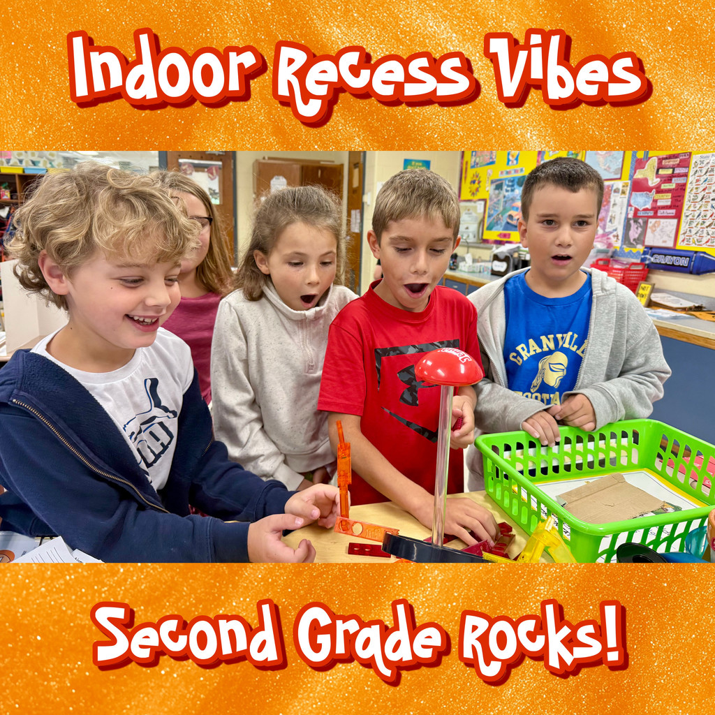 A picture of five 2nd grade students playing with indoor science toys during indoor recess in a classroom