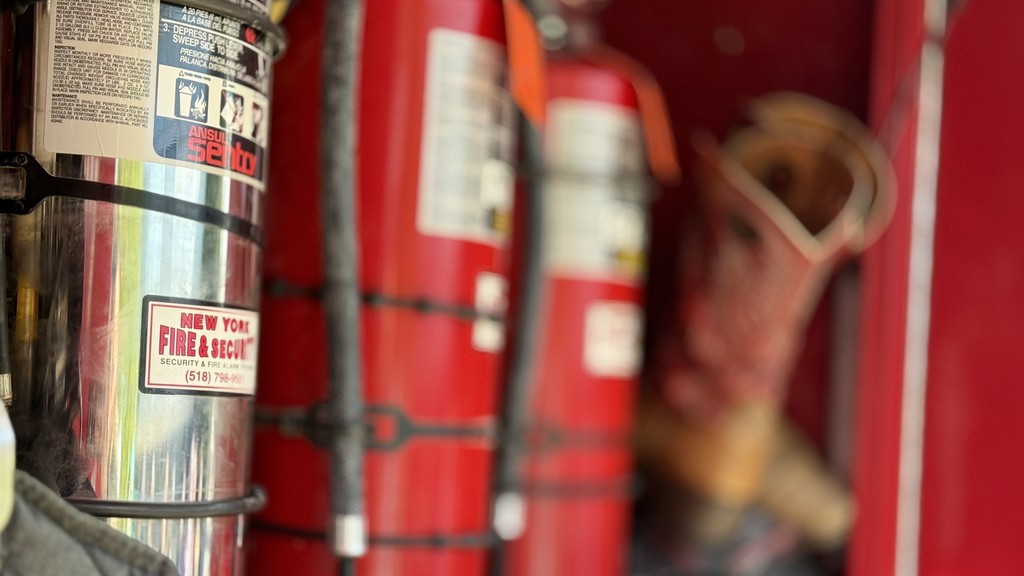 Image of a fire extinguisher on a fire truck