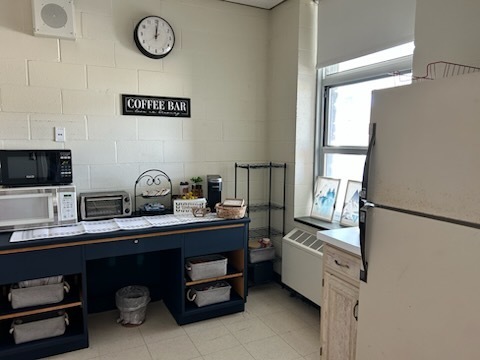 After: MJT Makeover picture of a coffee "bar" a desk painted blue with coffee supplies on it