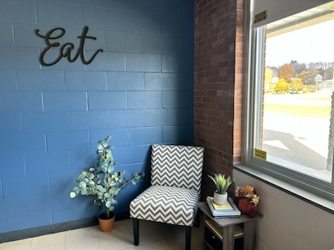After: MJT Makeover picture of comfortable grey and white chair by the window