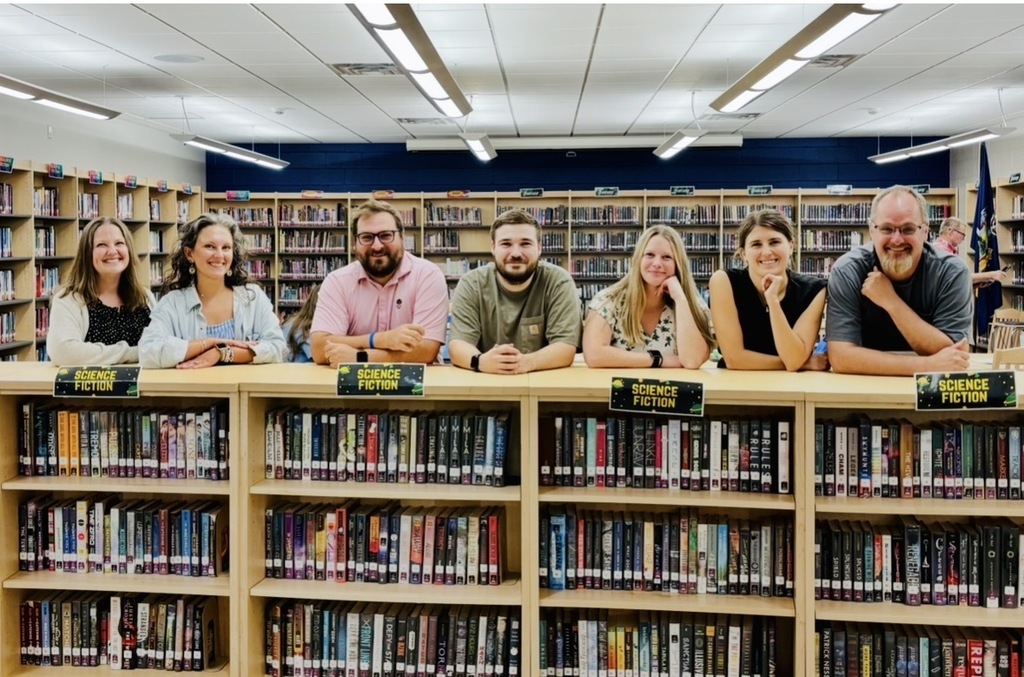 New Jr/Sr High Teachers! (Standing behind a bookcase) From Left to Right: Joanna Redding, Business and Math, Colleen Viera, Business, Ean Smith, Family and Consumer Science, Chris Sharpe, Math, Danielle Soloman, Music, Madison Prisco, Special Ed, Barry Lane, Technology and Power Sports Tech. Go Horde!