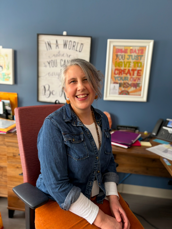 Mrs Mulvaney in her office seated in a chair