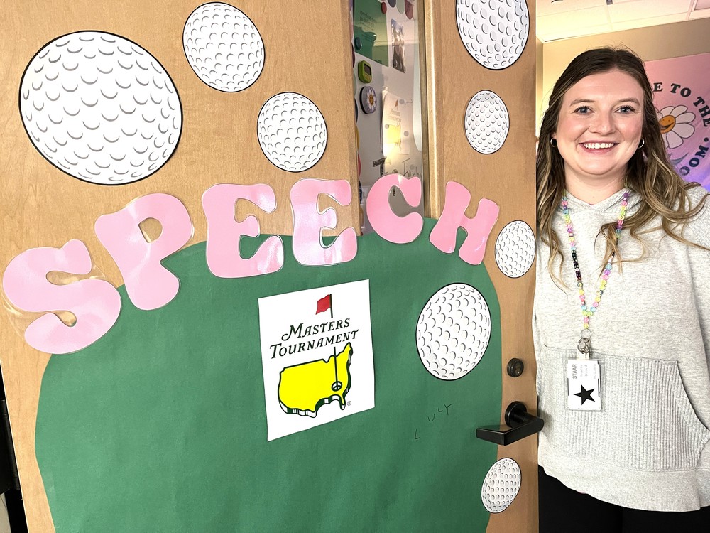 Speech pathologist at door