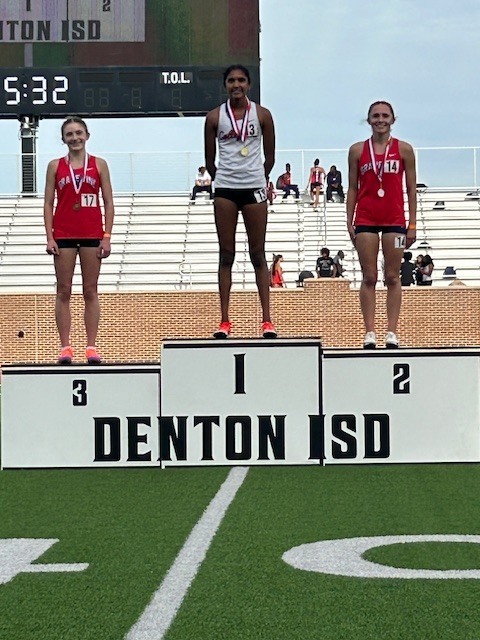 District Podium with GCISD Students on Top